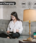Dimmable Touch Control 25 Inch Modern USB Table Lamp Set on living room table, brass finish, dual USB ports, energy-saving LED lit
