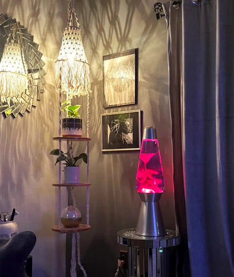 Room with cozy lighting including Plug In Rattan Pendant Light With Woven Bamboo Basket Shade, Dimmable Wicker Hanging Lamp, and a pink lava lamp.