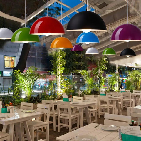 Colorful ceiling pendant light fixtures in a dining setting, featuring a glossy dome semicircle hanging lamp design.