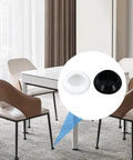 Dining room with close-up view of black and white snap-in rubber plugs for 45mm holes, ideal for furniture sealing and heat resistance.