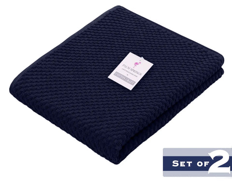 Two Pack Navy Blue Pool Lounge Chair Covers With Waffle Weave Cotton Terry Towels, folded with label visible, set of 2.