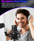 Man using Universal Microphone Shock Mount for 47mm to 53mm mics, anti-vibration clip holder in home studio