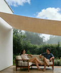 Beige Square Waterproof Sun Shade Sail 9.5 Ft By 9.5 Ft UPF50 Plus Canopy Awning Shelter installed over patio with two people seated