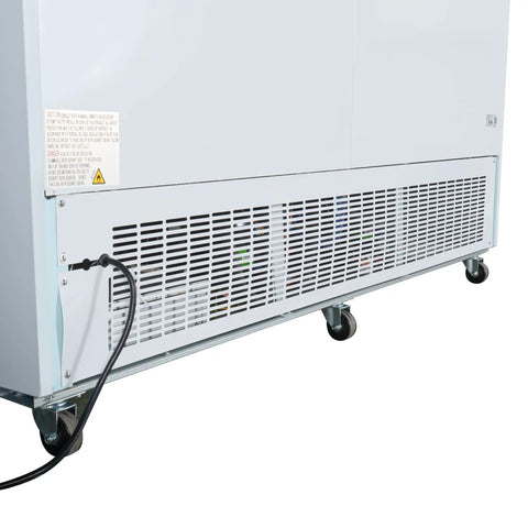 Back view of Heavy Duty Triple Glass Door Upright Freezer Merchandiser In Crisp White showcasing cooling unit and wheels.