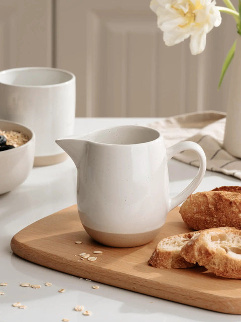 13oz Creamer With Handle Ceramic Pitcher For Coffee, Milk, Syrup And Sauce, Multipurpose Stoneware Jug, White on a table setting
