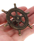 Close-up of antique bronze steering wheel door pull from 4 Piece Antique Cabinet Handles Set