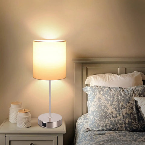 Bedroom setting with Set Of 2 Touch Control Table Lamps With USB Ports And AC Outlet, fabric shade, sleek nickel finish on nightstand.