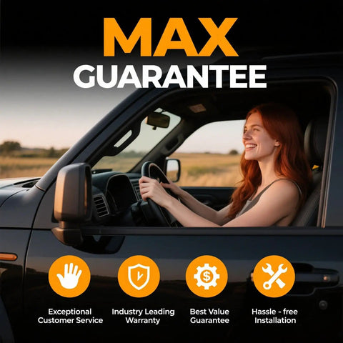 Woman smiling while driving a black truck showing MAX GUARANTEE features like customer service and installation.