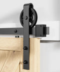 Heavy Duty Sliding Barn Door Hardware Rollers Black Two Pack Ultra Silent Pom Track Wheels Solid Build Carbon Steel Hangers mounted on wood door.
