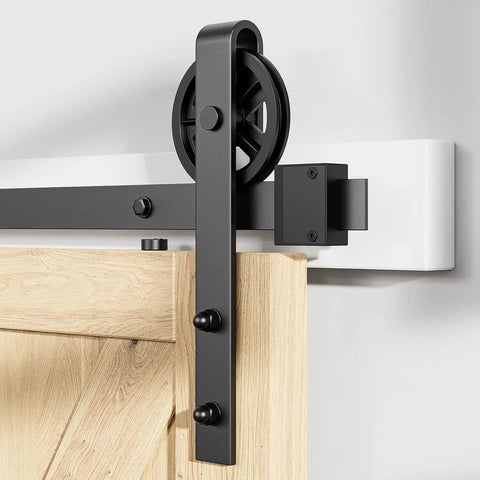 Heavy Duty Sliding Barn Door Hardware Rollers Black Two Pack Ultra Silent Pom Track Wheels Solid Build Carbon Steel Hangers mounted on wood door.