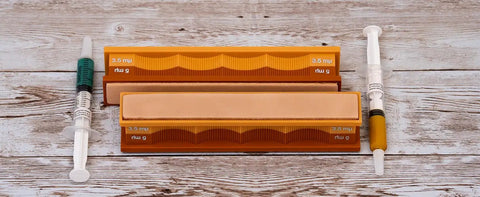 5/3.5 Micron Diamond And Leather Strops Pack For Knife Sharpening on wooden table with syringes