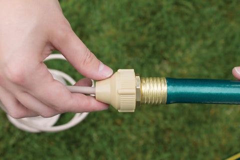 Hands connecting Portable Outdoor Mist Cooling System With One Quarter Inch Line, Ten Feet Of Mist Coverage, Installs In Under Ten Minutes