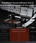 AtomStack Swift Mini laser engraver on desk; black and red compact desktop unit with 135×145mm engraving area.