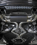 A-KARCK stainless steel 2.5-inch mandrel-bend exhaust kit undercar view with quad tips and muffler.