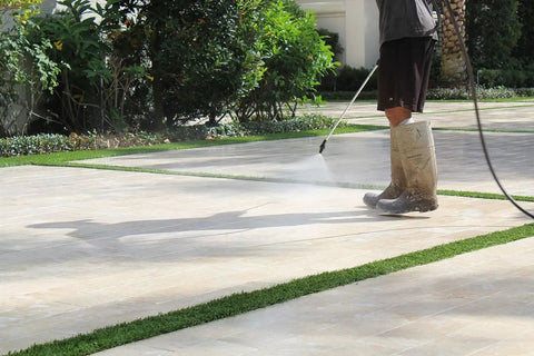 Premium Two Part Urethane Paver Sealer application on stone patio with pressure washer to enhance outdoor color.