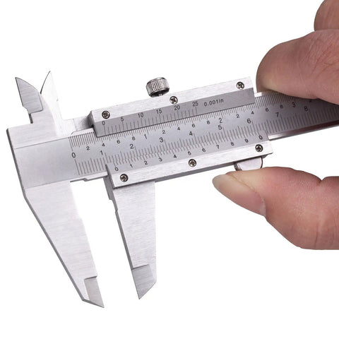 Hand holding Vernier Caliper Measuring Tool With 6 Inch Range And 0 To 150 Millimeters Manual Non Digital Calipers High Precision 0.001 Inch 0.02 Millimeters Durable Workhorse For Industrial Workshop Projects