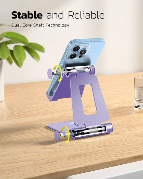 Dual Folding Phone Stand With Fully Adjustable Angles For IPhone 17 16 15 14 13 12 11 Pro Max Xs Xr X 8 And Nintendo Switch Desktop Cradle Dock All Phones Purple with phone on wooden desk