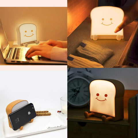 Toast Shaped Night Light With Cute Smile Face Double Or Single Side LED Toast Lamp Warm 4000K Eye Friendly Lit Glow For Bedroom Or Dorm Includes Phone Holder Cozy Room Decor And Graduation Gift For Teen Girls Ages 10 To 14, showing lamp on bedside table, next to clock.