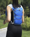 Back view of person wearing Mens Hydration Vest With Water Bladder Pack For Running Hiking Cycling Training Gear Ultralight Polyester Vest.