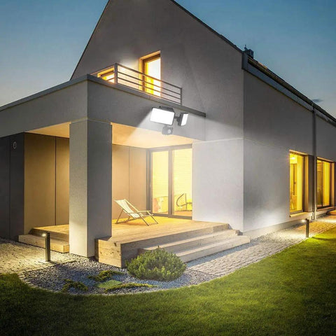 Ultra Bright Outdoor Security Flood Light With Motion Sensor 1500 Lumens illuminating house porch at night