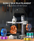 3D printer using Silk PLA Filament 1.75mm 1kg with glossy silk finish, surrounded by colorful filament spools, ideal for art projects