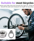 Mechanic installing 24 Piece Bike Axle Nut And Washer Kit Universal Fit M8 M9.5 M10 on bicycle wheel in workshop