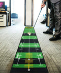 Person using Ten Foot By Twenty Inch Golf Putting Green Mat With Multi Distance Markers Anti Slip Backing in office setting
