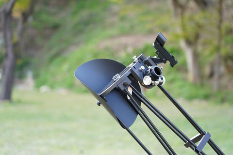 Ultra Light 6 Inch Portable Dobsonian Telescope For Travel with light shroud and smartphone mount in outdoor setting