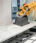 Four Pack Heavy Duty Rubber Replacement Belts For Sealing Machines on industrial machine platform with robotic arm.