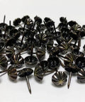 Premium 7/16 Inch Upholstery Tacks For Furniture Fix Ups, Slick Decorative Nailheads For Easy Diy Home Makeovers, Snug Fit Electroplated Fasteners That Are Damn Good To Work With, 100 Pack pile of matte black decorative upholstery tacks