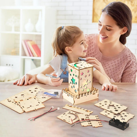 Mother and daughter assembling a star nightlight from Five In One Wooden STEM Kits For Kids With Amusement Park Theme