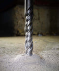 SDS Plus rotary hammer drill bit, 5/32 x 6 in, carbide-tipped, front view piercing concrete dust