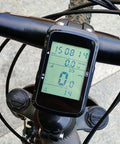 GPS Bike Computer With 2.4 Inch Screen And 28 Hour Battery Life For Mountain And Road Cycling, displaying data on handlebars.