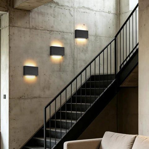 Modern Wood LED Linear Wall Sconce, Mini Up Down Wall Mount Light,Hardwired,UL Listed,Wood Wall Lighting Fixture for Bedroom, Living Room,Stairway, Hallway, (Black) 2 Pack installed on a concrete wall next to a staircase.