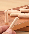 Close-up of a wooden dowel pin from a 90 Piece Wooden Dowel Pins Set With Tapered Beveled Ends For Easy Insertion In Furniture, Doors, Cabinets And DIY Crafts