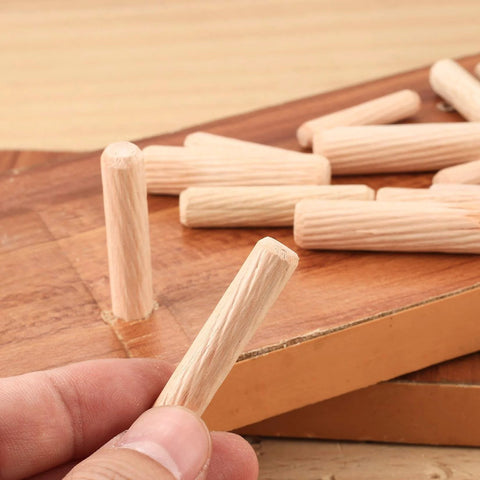 Close-up of a wooden dowel pin from a 90 Piece Wooden Dowel Pins Set With Tapered Beveled Ends For Easy Insertion In Furniture, Doors, Cabinets And DIY Crafts