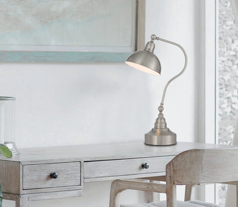 Industrial Downbridge Floor Lamp With Adjustable Head And Arm Heavy Metal Build on wooden desk, modern decor