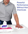 Person using Foodservice Surface Sanitizing Wipes Flowpack 7.4 By 9 Inches Durable Thick Wipes 72 Count Pack Of 12 on table