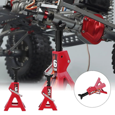 Set of four red metal RC car jack stands (3/6 ton) installed under a crawler chassis.