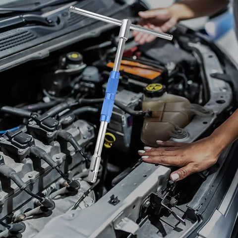 Pro Grade Half Inch Drive T Handle Socket Wrench Built Tough With Detachable Shaft in use on a car engine.