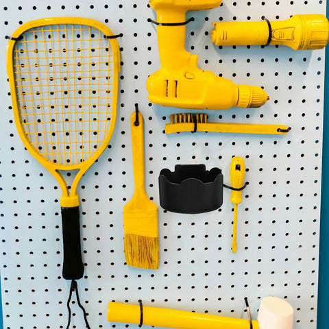 Black Plastic Aerosol Can Holder Wall Mount Organizer for Spray Bottles and Cans on a pegboard with yellow tools