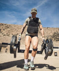 Person using Heavy Duty Farmer's Walk Strongman Carry Rack With Elevated Neutral Handles, 600 Lb Capacity, 28mm Solid Steel Bars outdoors.