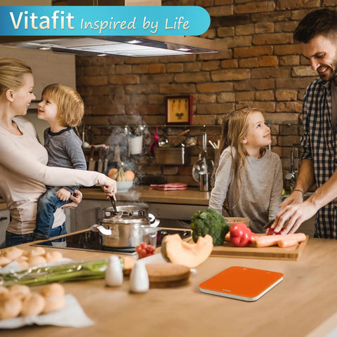Family cooking with High Precision 33Lb Digital Kitchen Scale With LED Display in orange finish on counter