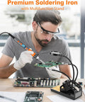 Man using 100W High Power Soldering Iron Kit With LCD Display For Quick Heat Up All In One Soldering Pro Tool With Magnifying Glass helping hands