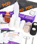 Lightning X EMT bag: sterile gauze sponges, white gauze rolls, burn dressing gel packs, cohesive wraps, scissors.