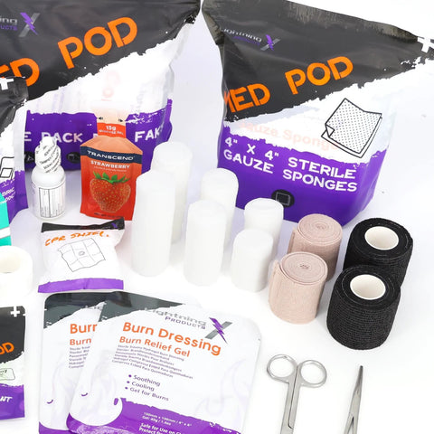Lightning X EMT bag: sterile gauze sponges, white gauze rolls, burn dressing gel packs, cohesive wraps, scissors.