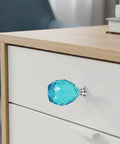 Blue crystal knob from Four Piece Door Knob Molds For Epoxy Resin, DIY Crystal Silicone Casting Kit on a white cabinet drawer