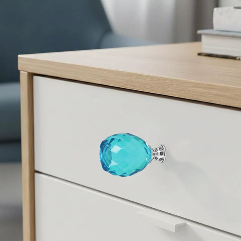 Blue crystal knob from Four Piece Door Knob Molds For Epoxy Resin, DIY Crystal Silicone Casting Kit on a white cabinet drawer