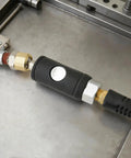 Quarter Inch Push Button Safety Air Coupler Quick Disconnect for Pneumatic Tools, Female IM Type, brass body on metal surface.