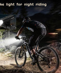 Cyclist using 400 Lumen Rechargeable Bike Headlight For Night Riding With IP66 Waterproof Front Light on mountain trail